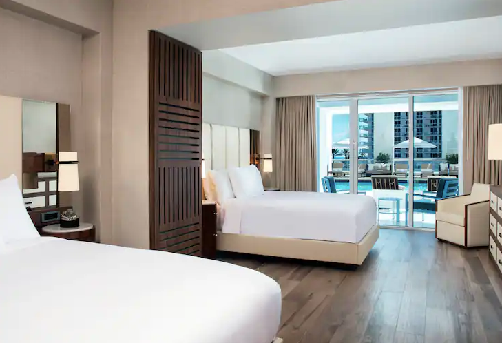 One Bedroom Suite - Poolside View with Two Queen Beds