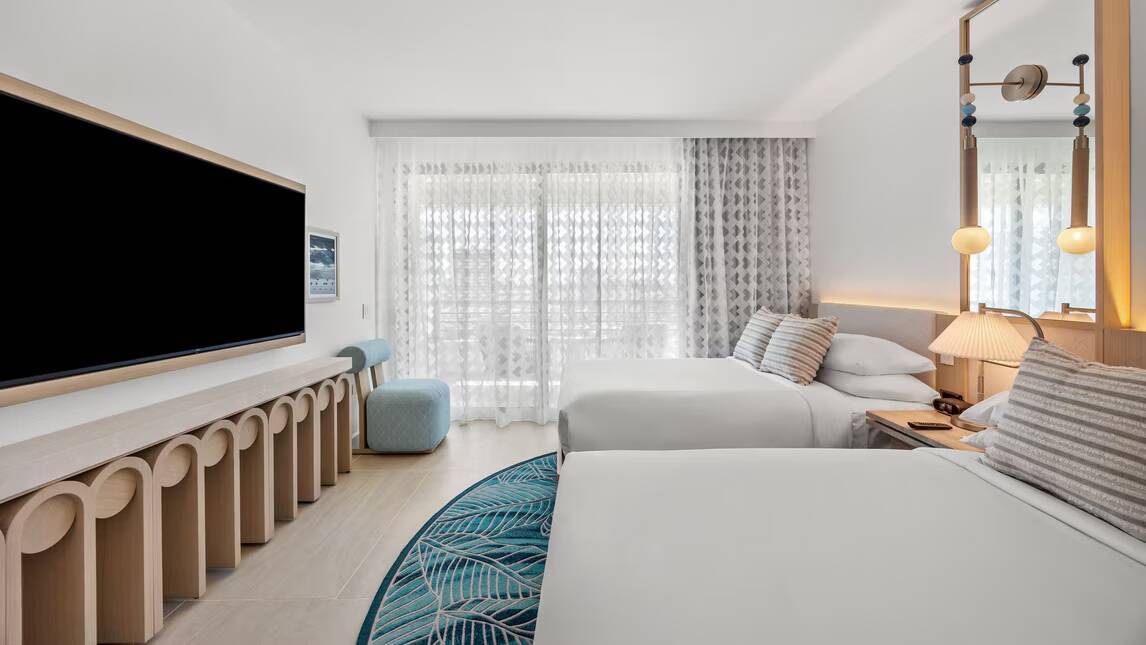 One Bedroom Deluxe Suite King Sofa bed Partial ocean view Balcony